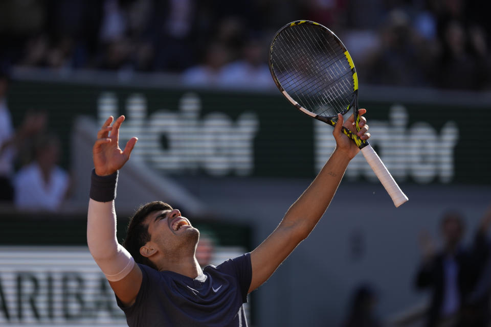 Spain's Carlos Alcaraz celebrates after winning the semifinal match of the French Open tennis tournament against Italy's Jannik Sinner at the Roland Garros stadium in Paris, Friday, June 7, 2024. (AP Photo/Thibault Camus)