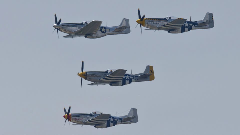 North American P-51 Mustangs fly over the National Mall during the Arsenal of Democracy, a WWII plane flyover for the 70th anniversary of V-E Day in Washington, DC, on May 8 2015. - Andrew Caballero-Reynolds/AFP/Getty Images