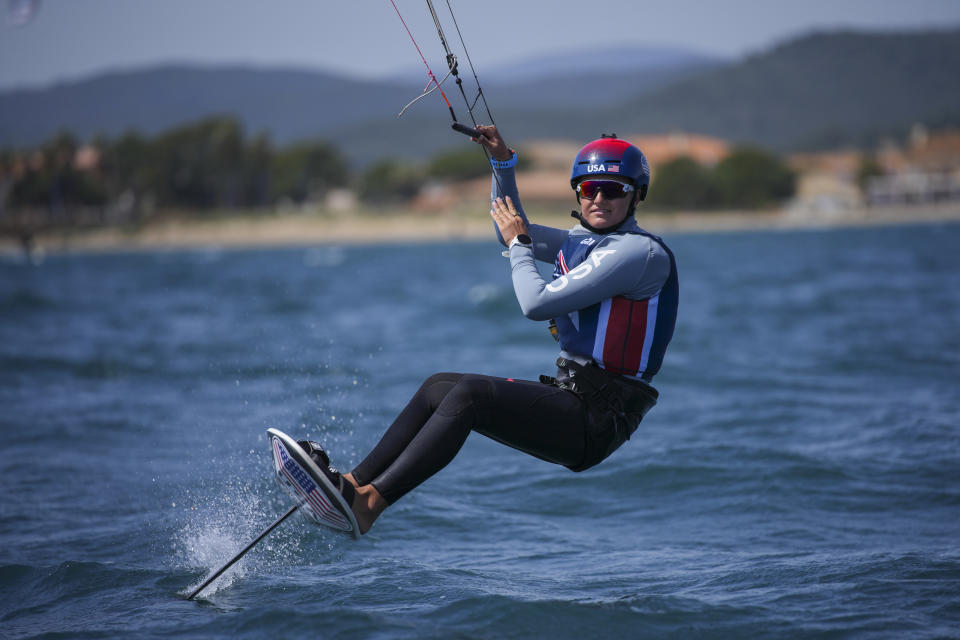 FILE - U.S. Olympic sailing team member Daniela Moroz kiteboards during a training session in Hyeres, southern France, Monday, April 29, 2024. The fastest sport at the Paris Games has such wild speeds that the athletes say the waves and the wind become muted. (AP Photo/Daniel Cole, File)