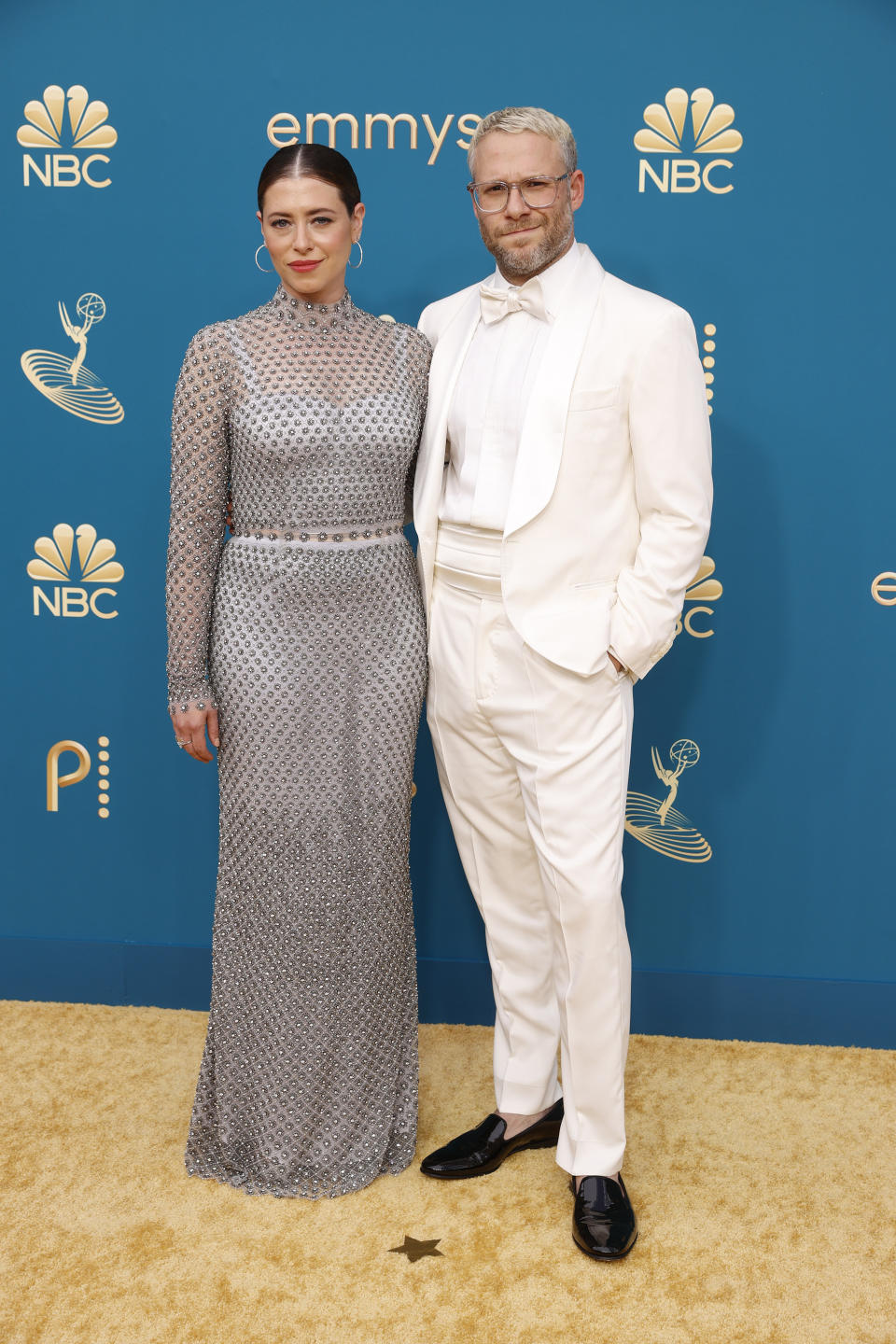 Lauren Miller Rogen in a silver sequined gown and Seth Rogen in a white tux