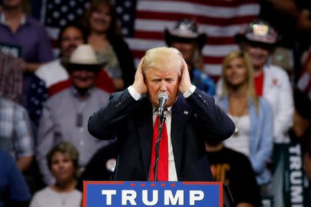 Republican U.S. presidential candidate Donald Trump jokes about how difficult he says it is for him to listen to Democratic candidate Hillary Clinton's voice as he holds a rally with supporters in Fresno, California, U.S. May 27, 2016. REUTERS/Jonathan Ernst