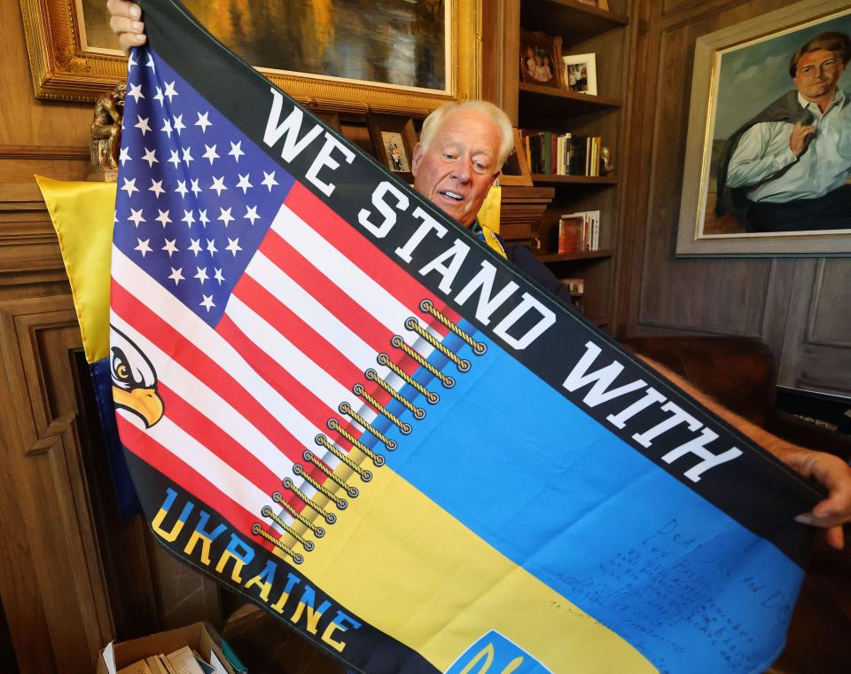 Dell Loy Hansen holds a flag given to him as he talks about his investment in the Ukraine with Love housing project at his home in Holladay on Friday, Oct. 6, 2023. | Jeffrey D. Allred, Deseret News