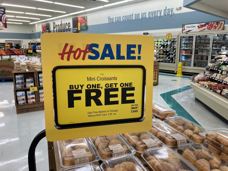 A sale sign advertising buy one get one free at Food Lion