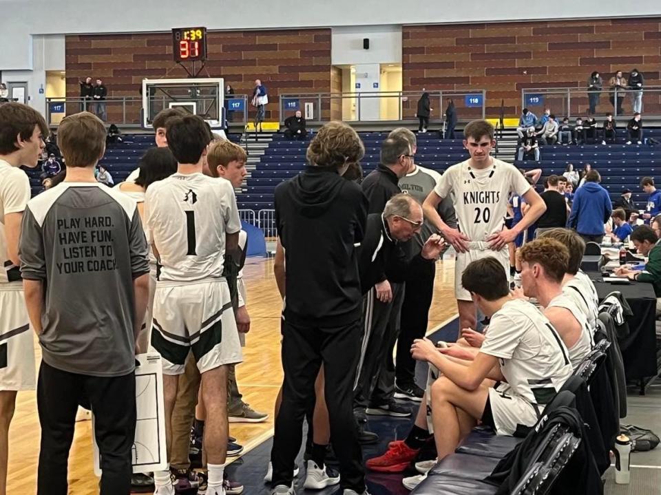 Hamilton coach Tom Blackford speaks to his team during a timeout in the Emerald Knights 52-42 win over Madison in the Section III Class D semifinal at SRC Arena in Syracuse on February 25, 2022.