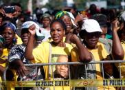 Supporters of former President Jacob Zuma sing as he appears in the High Court where he faces charges that include fraud, corruption and racketeering, in Pietermaritzburg