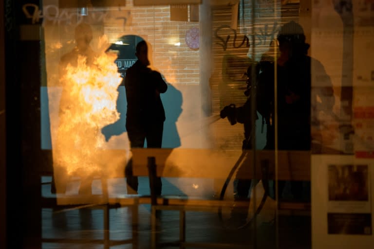 The clashes in Madrid saw angry protesters set fire to dustbins and motorbikes, and throw stones at riot police