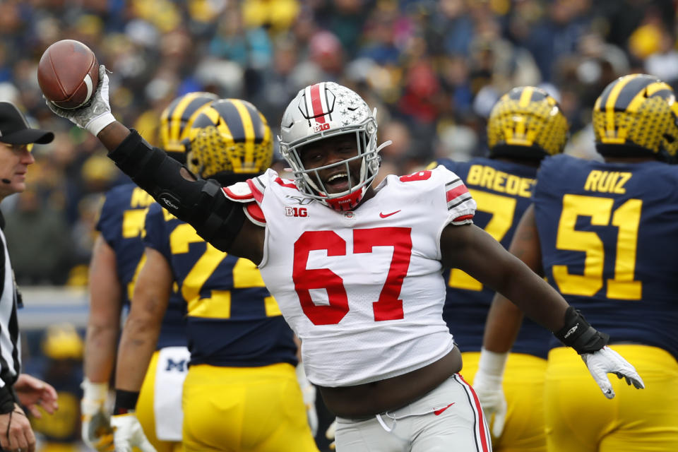 Ohio State defensive lineman Robert Landers (67) celebrates recovering a Michigan fumble in the first half of an NCAA college football game in Ann Arbor, Mich., Saturday, Nov. 30, 2019. (AP Photo/Paul Sancya)