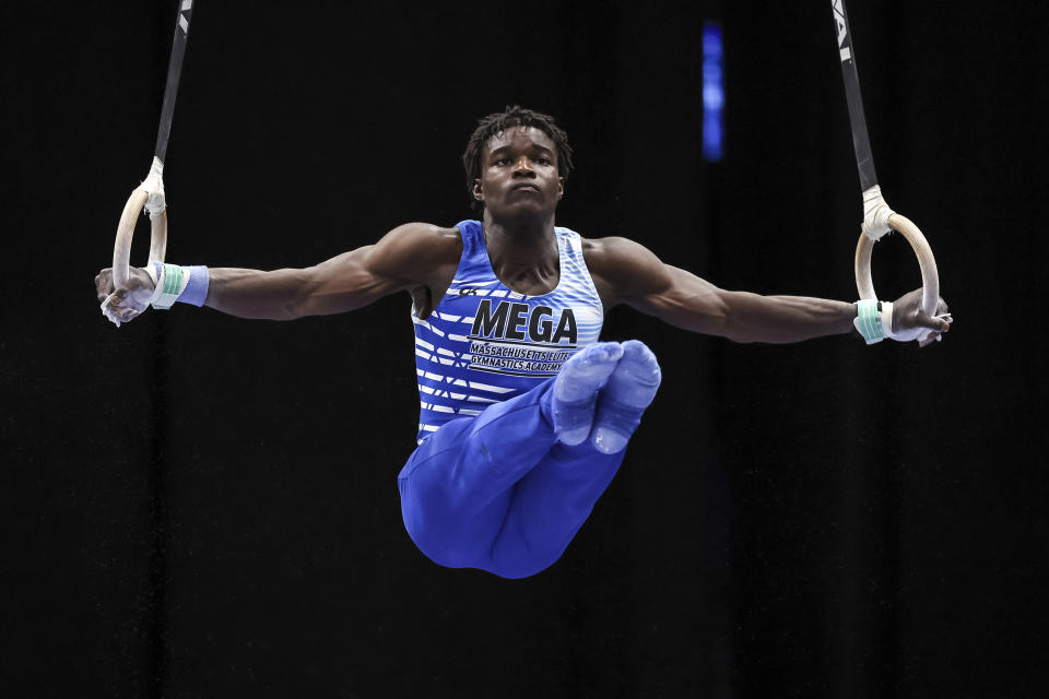 FILE - Fred Richard performs on the rings during the U.S. Gymnastics Championships, Saturday, Aug. 20, 2022, in Tampa, Fla. Simone Biles is bringing back her Gold Over America Tour this fall, with a twist. This time, the guys are invited too. (AP Photo/Mike Carlson, File)