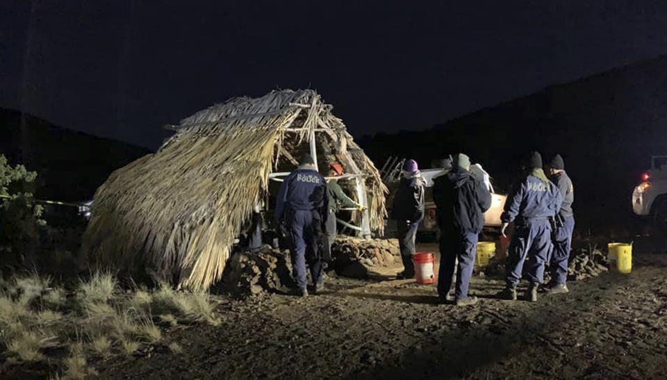 In this photo provided by Pi'ikea Keawekane-Stafford, state and county officials remove Native Hawaiian structures from Mauna Kea, Thursday, June 20, 2019. After years of protests and legal battles, Hawaii officials announced Thursday that a massive telescope which will allow scientists to peer into the most distant reaches of our early universe will be built on a volcano that some consider sacred. The state has issued a "notice to proceed" for the Thirty Meter Telescope project, Gov. David Ige said at a news conference. Ige said four unauthorized structures were removed from the Mauna Kea mountain earlier in the day. (Pi'ikea Keawekane-Stafford via AP)