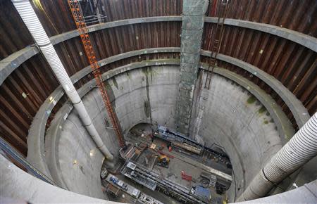 Workers stand in an access excavation at the entrance of the tunnels at Crossrail's Limmo Peninsula site in east London December 14, 2012. REUTERS/Andrew Winning