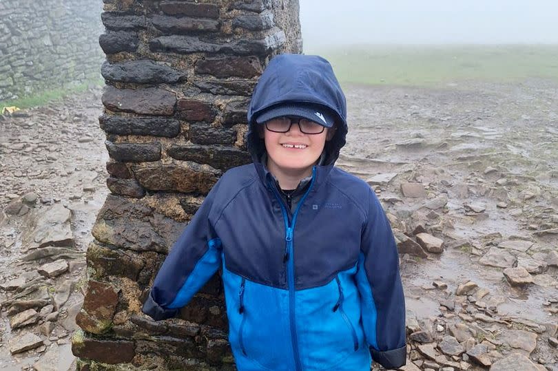 Luke Mortimer at the top of Pen-Y-Ghent -Credit: Christine Mortimer / SWNS