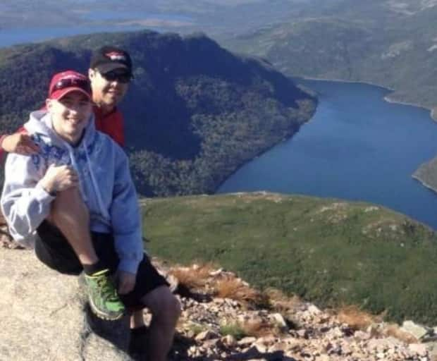 Bay of Islands native Michael Gaultois and his son, Ryan Murrin, are pictured on Gros Morne Mountain. The men enjoy a close relationship.  (Submitted by Michael Gaultois - image credit)