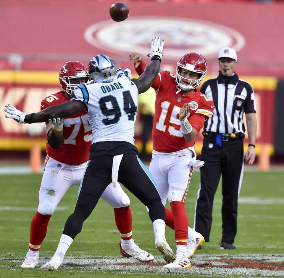 Kansas City Chiefs quarterback Patrick Mahomes throws while being pressured by the Carolina Panthers’ Efe Obada at Arrowhead Stadium Sunday, Nov. 8, 2020. The Chiefs edged the Panthers 33-31.