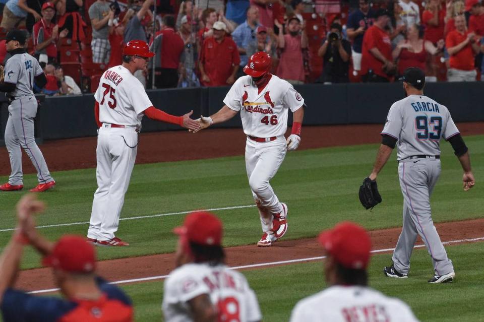 St. Louis Cardinals’ Paul Goldschmidt (46) is congratulated by third base coach Ron “Pop” Warner after hitting a game-ending home run during the ninth inning of the team’s baseball game against the Miami Marlins on Tuesday, June 15, 2021, in St. Louis.