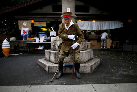 A man dressed as a Japanese imperial army soldier stands at Yasukuni Shrine in Tokyo, Japan August 15, 2017, to mark the 72nd anniversary of Japan's surrender in World War Two. REUTERS/Issei Kato