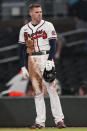 Atlanta Braves' Freddie Freeman waits in the infield after flying out to end the ninth inning of the team's baseball game Colorado Rockies on Wednesday, Sept. 15, 2021, in Atlanta. (AP Photo/John Bazemore)