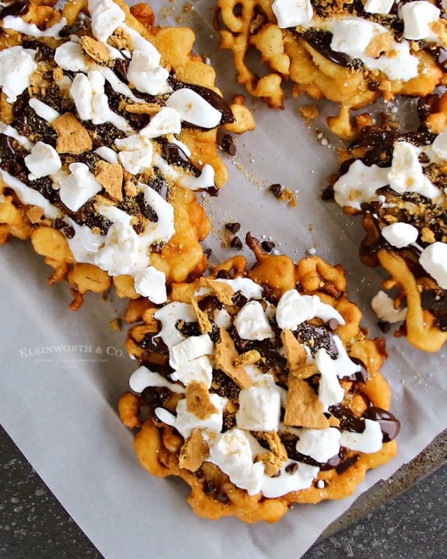 <p>Kleinworth & Co.</p><p>Two summer favorites in one fun treat.</p><p><strong>Get the recipe: <a href="http://www.kleinworthco.com/2017/05/easy-smores-funnel-cake.html" rel="nofollow noopener" target="_blank" data-ylk="slk:S'Mores Funnel Cake;elm:context_link;itc:0;sec:content-canvas" class="link ">S'Mores Funnel Cake</a></strong></p>