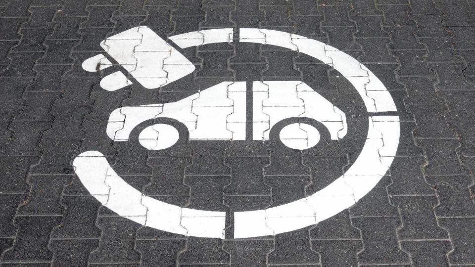 Electric charging station symbol and inscription on a street