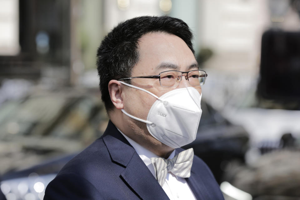 The ambassador of the Permanent Mission of the People's Republic of China to the United Nations, Wang Qun, speaks to media in front of the 'Grand Hotel Vienna', where closed-door nuclear talks with Iran take place, in Vienna, Austria, Tuesday, April 20, 2021. (AP Photo/Lisa Leutner)