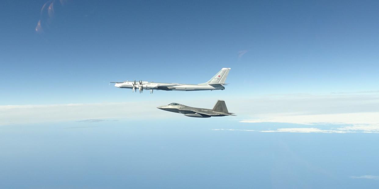 A US Air Force F-22 intercepting a Russian Tu-95 bomber