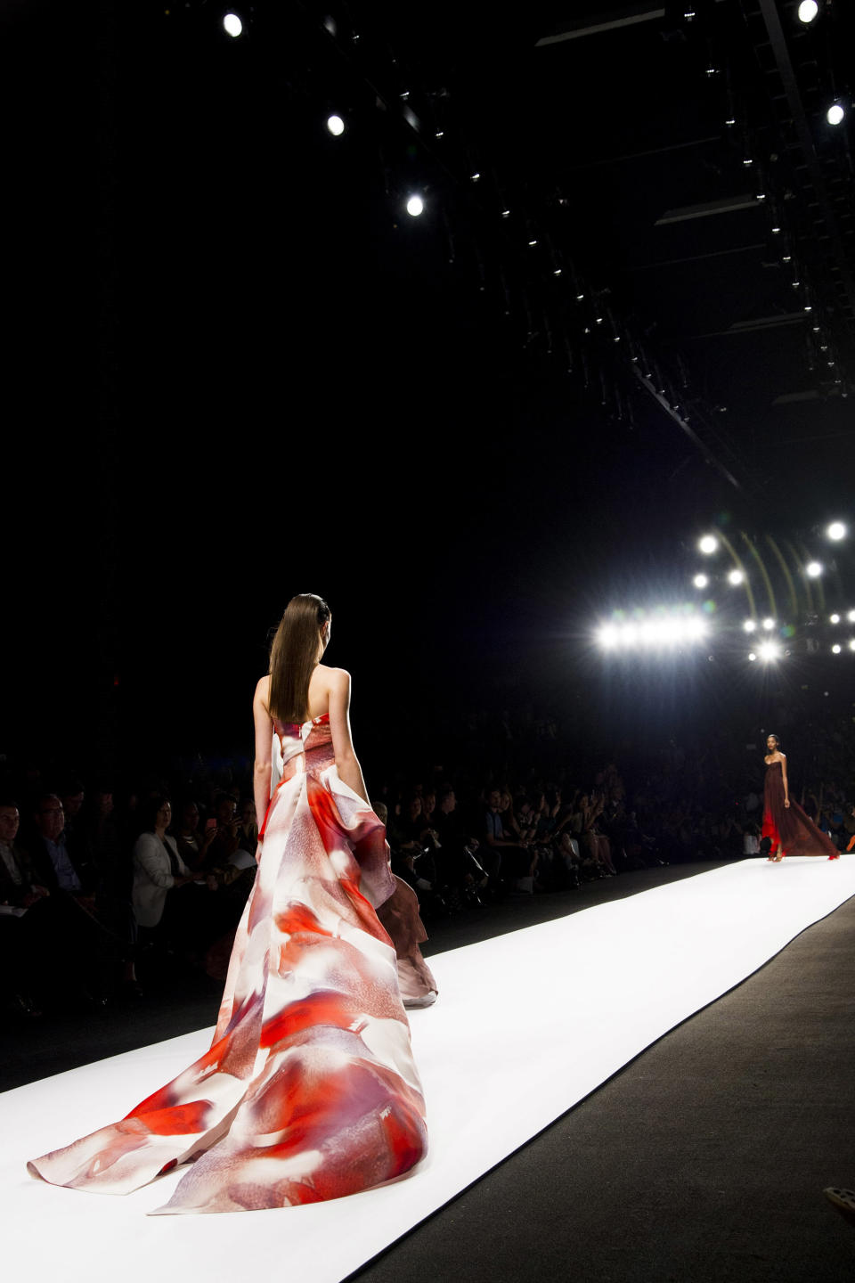 The Monique Lhuillier Spring 2014 collection is modeled during Mercedes-Benz Fashion Week in New York, Saturday, Sept. 7, 2013. (Photo by Charles Sykes/Invision/AP)