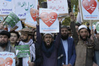 Afghans shout slogans during a protest against French President Macron's comments over Prophet Muhammad caricatures, in Kabul, Afghanistan, Friday, Oct. 30, 2020. (AP Photo/Mariam Zuhaib)