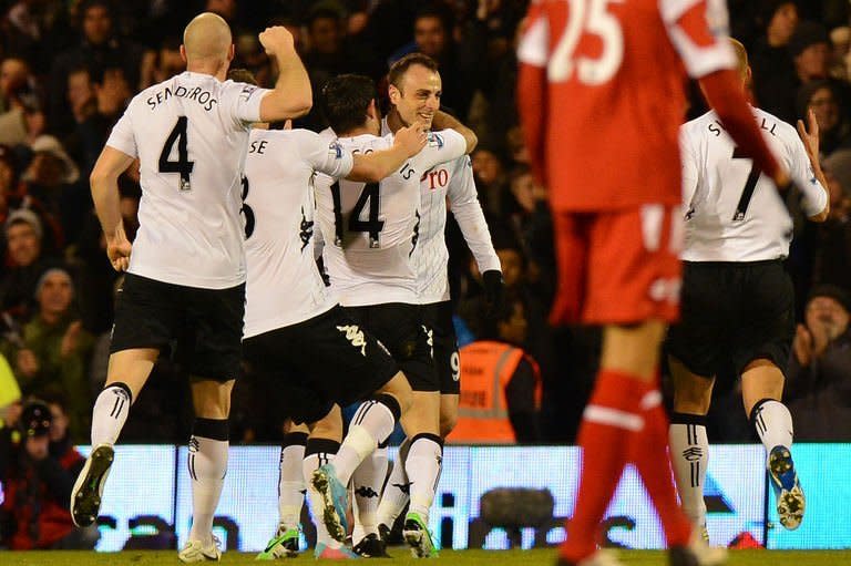 Fulham forward Dimitar Berbatov (C) celebrates his second goal during their Premier League match against Queens Park Rangers in London on April 1, 2013. QPR spurned another chance to improve their chances of survival in the Premier League after a gripping 3-2 loss at Fulham