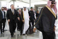 U.S. Secretary of State Mike Pompeo, left, walks with Saudi Foreign Minister Ibrahim Abdulaziz Al-Assaf, as Pompeo arrives in Jeddah, Saudi Arabia, Monday, June 24, 2019. Pompeo is conducting consultations during a short tour of the Middle East, including visits to Saudi Arabia and United Arab Emirates. (AP Photo/Jacquelyn Martin, Pool)