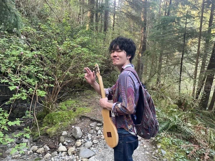 Co-workers of Wataru Kakiuchi, the victim of a fatal stabbing in Vancouver's Chinatown neighbourhood, remember him as a great musician.  (Submitted by Justin Ault - image credit)