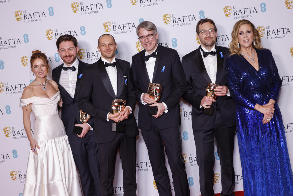 Geri Halliwell, from left, Viktor Prasil, Markus Stemler, Frank Kruse, Lars Ginze and Rita Wilson pose with the sound award for 'All Quiet on the Western front', at the 76th British Academy Film Awards, BAFTA's, in London, Sunday, Feb. 19, 2023. (Photo by Vianney Le Caer/Invision/AP)