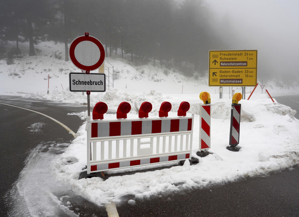 A road in the Black Forest is closed due to snow in Seebach, southern Germany, Monday, Jan. 14, 2019. Authorities in parts of Austria, Germany and Switzerland have warned that further snow and rainfall is raising the risk of avalanches, and increase the weight on snow-laden roofs. (Benedikt Spether/dpa via AP)