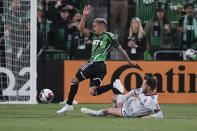 Austin FC midfielder Daniel Pereira (6) moves the ball past St Louis City FC forward Joao Klauss (9) during the first half of an MLS soccer match in Austin, Texas, Saturday, Feb. 25, 2023. (AP Photo/Eric Gay)