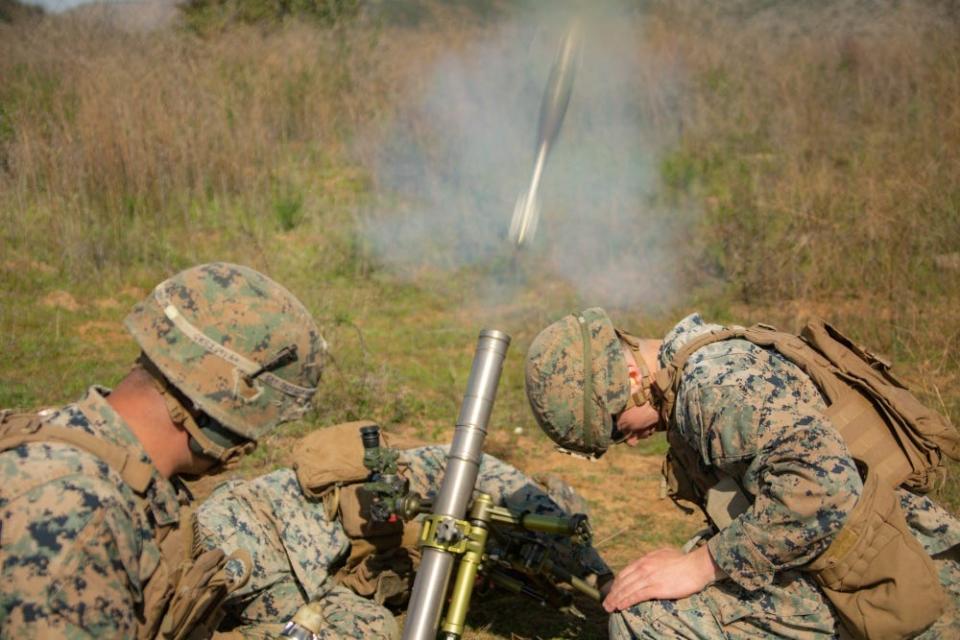 US Marines with 2nd Battalion, 1st Marine Regiment, 1st Marine Division, fire an M224 60mm mortar system for a live-fire range during Exercise Iron Fist 2020 on Marine Corps Base Camp Pendleton, California