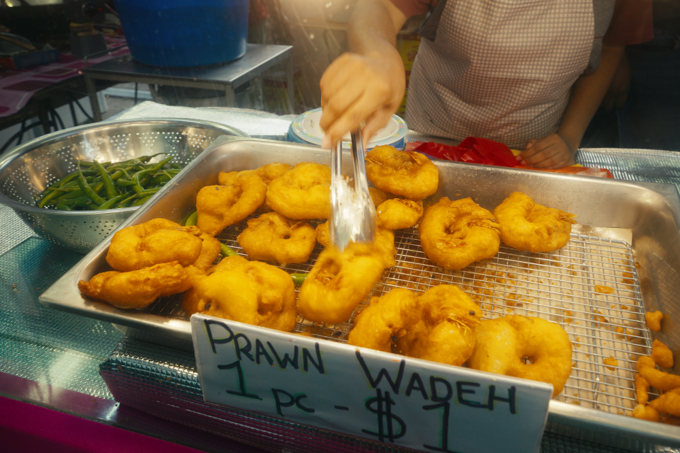 The cheapest vadai in the Geylang Serai bazaar at $1 one piece, according to Raj, the owner of 'Mr Wadeh' stall.