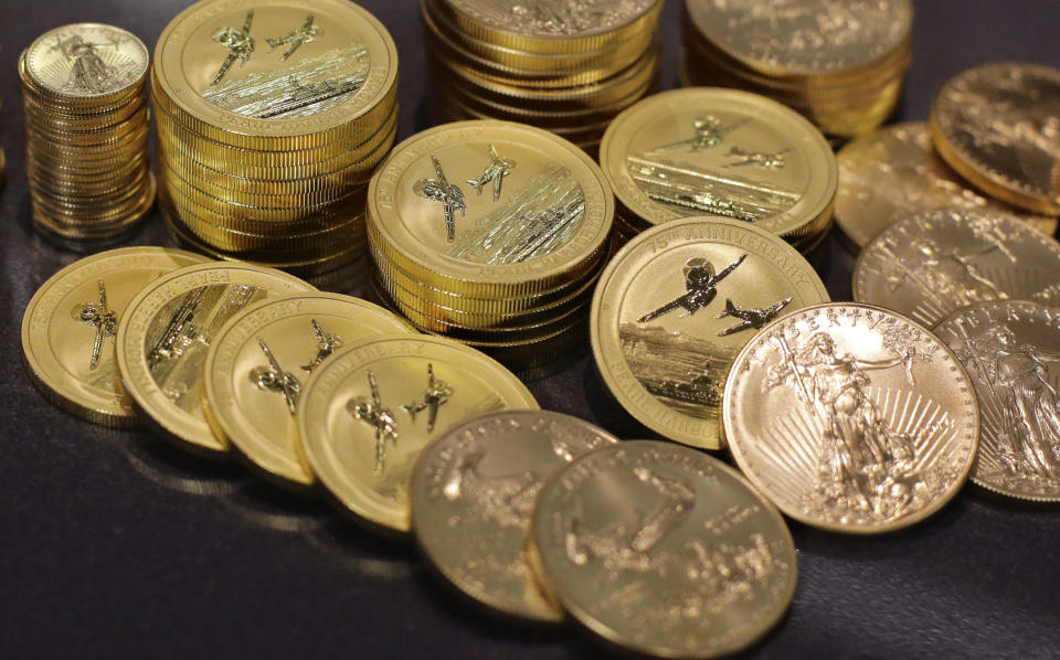 FILE - Gold coins are displayed at the office of Philip Diehl in Austin, Texas on July 1, 2016. (AP Photo/Eric Gay, File)