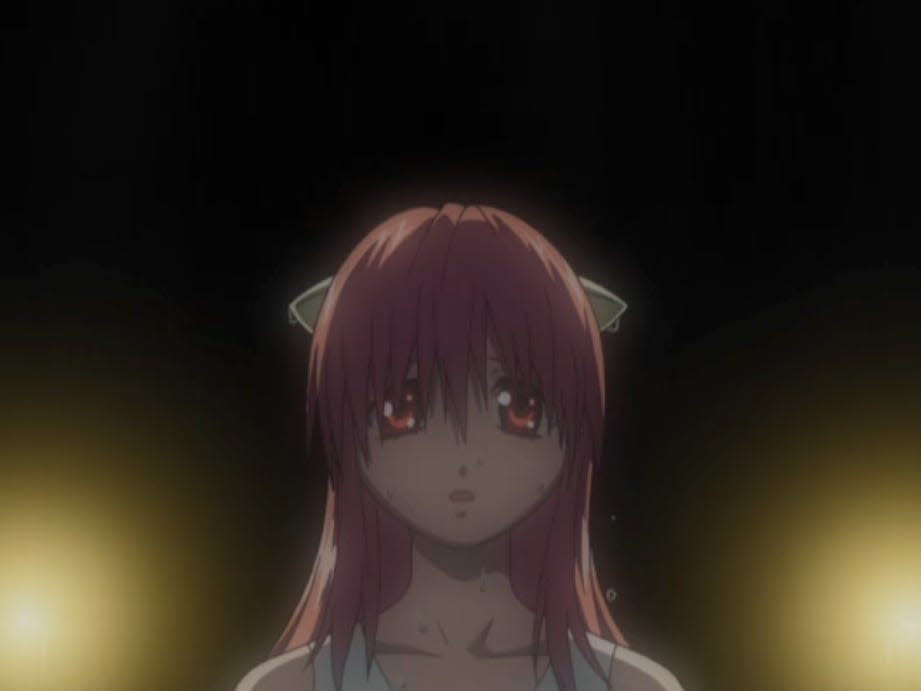 lucy in elfen lied, a young woman with pink hair, sharp horns on the side of her head, and a downtrodden expression