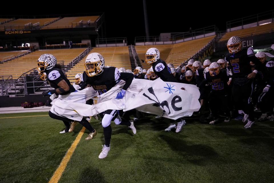 Nov 18, 2022; Columbus, Ohio, USA;  The Gahanna Lincoln Lions take the field for the high school football Div. I regional final against the New Albany Eagles at Historic Crew Stadium. Mandatory Credit: Adam Cairns-The Columbus Dispatch