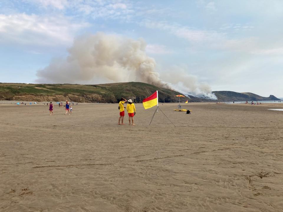 Smoke is seen pouring from the cliffs near Newgale Beach in Pembrokeshire (Sam Russell/PA)