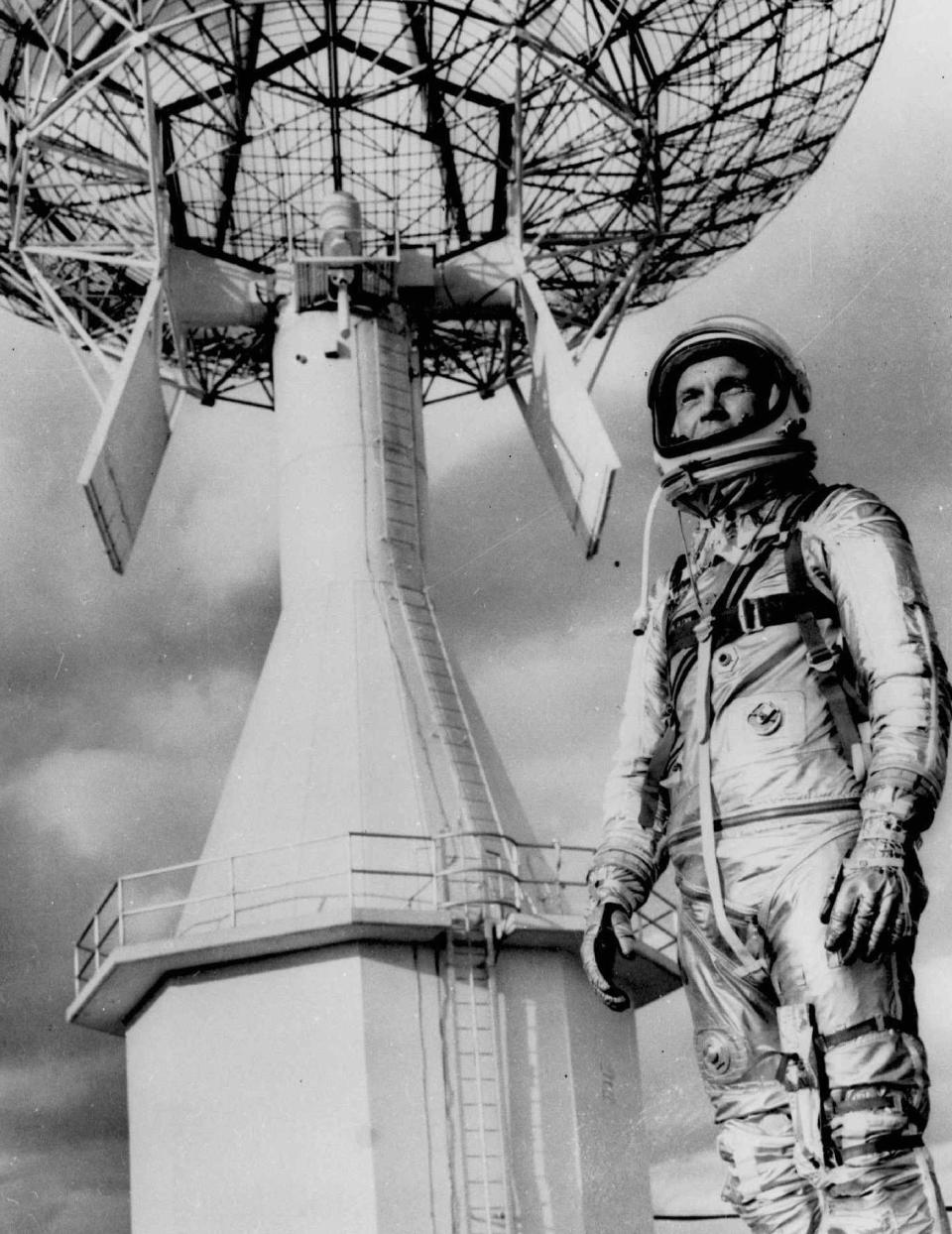 FILE- In this June 18, 1963 file photo astronaut John Glenn, the first American to orbit the earth, posing before a Project Mercury tracking station at Cape Canaveral, Fla. A panel is scheduled to vote Thursday, Feb. 25, 2021, on bringing a statue of the late astronaut and U.S. senator to the Ohio Statehouse to mark major future milestones, such as his birthday and the anniversary of his famous space flight. Glenn died in 2016 at age 95. (AP Photo, File)