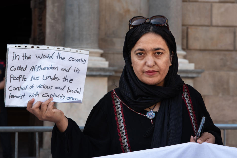 An Afghan woman holds a placard during a rally against any international recognition of the Taliban as Afghanistan's legitimate government, in Barcelona, Spain, April 30, 2023. / Credit: Ximena Borrazas/SOPA Images/LightRocket/Getty
