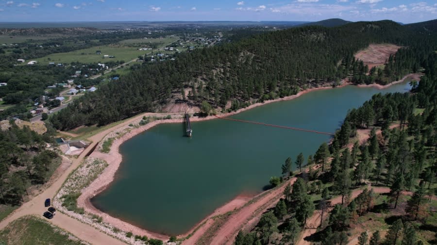 <em>The Bradner Reservoir, which supplies drinking water for the city of Las Vegas, N.M., is seen from the air in August. Officials say at one point this summer, the city only had 35 days’ worth of water left.</em>