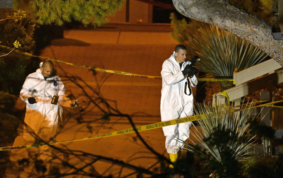 Forensics officers scour the scene at the Borderline Bar & Grill after the shooting. (PA)