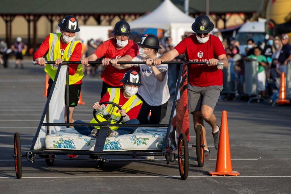 Miranda Construction weaves through cones during the 2021 KDF Ashley HomeStore Great Bed Races at the Kentucky Expo Center on Monday evening. April 26, 2021