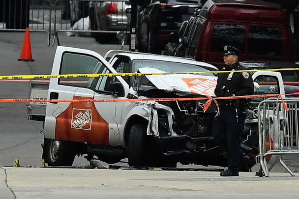 PHOTO: A police officer walks past the wreckage of a Home Depot pickup truck, a day after it was used in a terror attack, Nov. 1, 2017, in New York. (Jewel Samad/AFP via Getty Images)