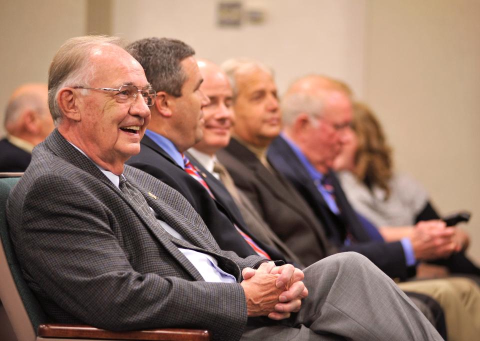 City councilman Lon Heide laughs while waiting to be sworn into office on Nov. 30, 2011.