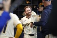 Milwaukee Brewers third base Oliver Dunn (15) celebrates with the dugout after his first career home run during the fourth inning of a baseball game against the Seattle Mariners, Friday, April 5, 2024, in Milwaukee. (AP Photo/Kayla Wolf)
