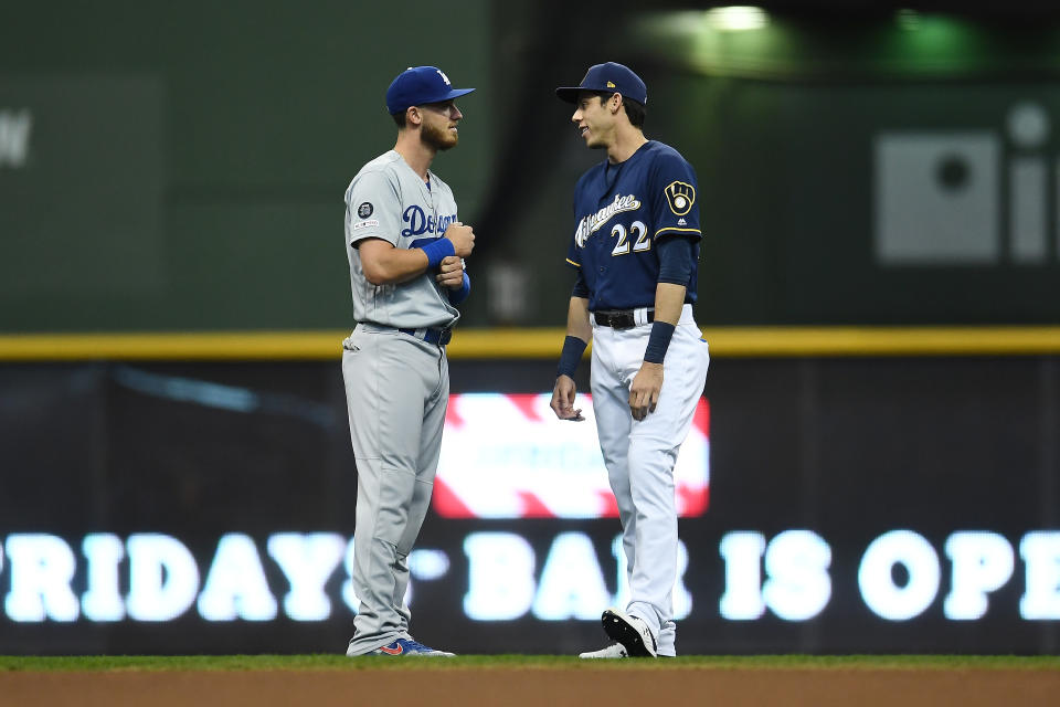 MILWAUKEE, WISCONSIN - APRIL 18:  Cody Bellinger #35 of the Los Angeles Dodgers and Christian Yelich #22 of the Milwaukee Brewers talk prior to a game at Miller Park on April 18, 2019 in Milwaukee, Wisconsin. (Photo by Stacy Revere/Getty Images)