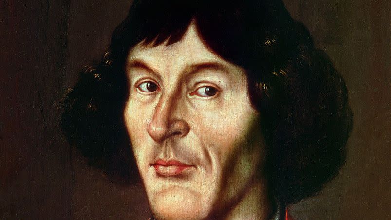 nicolaus copernicus wearing a red outfit in a portrait painting