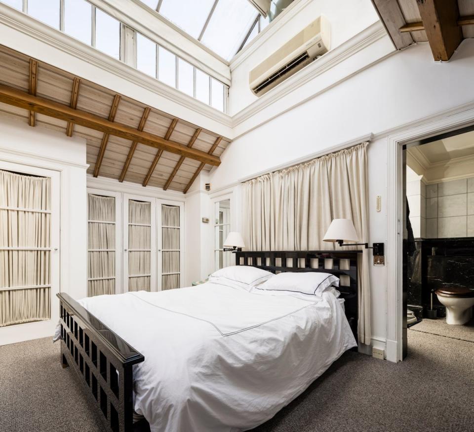 The principal bedroom on the mezzanine level with its lantern skylight (Grant Frazer /Beauchamp Estates)