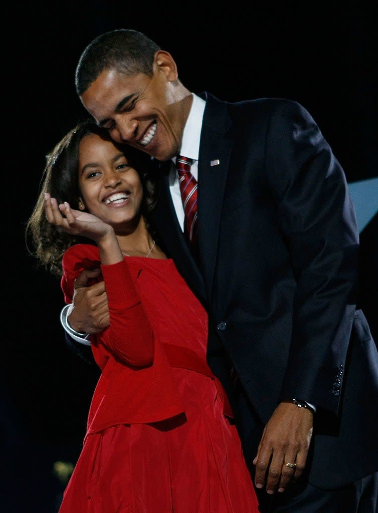 Malia Obama hugging her father, former president Barack Obama